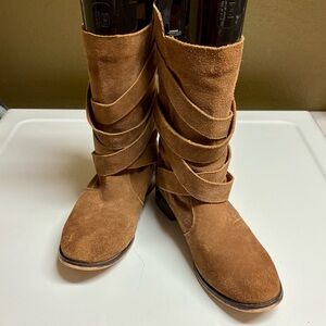 Restricted boots with decorative buckles